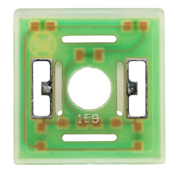 A close-up of the green circuit board from the Leybold North America Interference Suppression Kit Illuminated for SECUVAC Valves - 24 V DC, featuring a central circular opening. The board is equipped with metallic connectors on either side of the hole and brownish-gold circuitry paths. The number "159" is printed below the opening. It has a square shape with rounded edges.