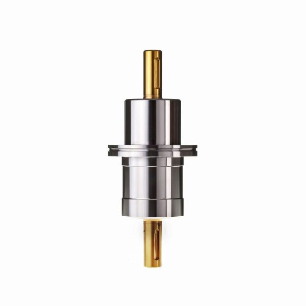 A shiny cylindrical component made of metal, featuring gold-colored ends, is centered on a white background. The Leybold North America Rotary Feedthrough FR 63/100 N appears symmetrical and showcases intricate detailing along its body, engineered to enable rotational motion even in vacuum environments.