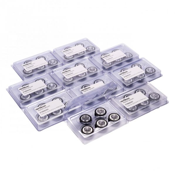 Explore the Set of Centering Rings ISO-KF from Leybold North America, consisting of nine transparent plastic cases, each filled with small, round metal ball bearings perfect for vacuum systems. Each case includes a label with text, organized in a grid pattern on a white background and accompanied by ISO-KF centering rings to ensure enhanced precision.