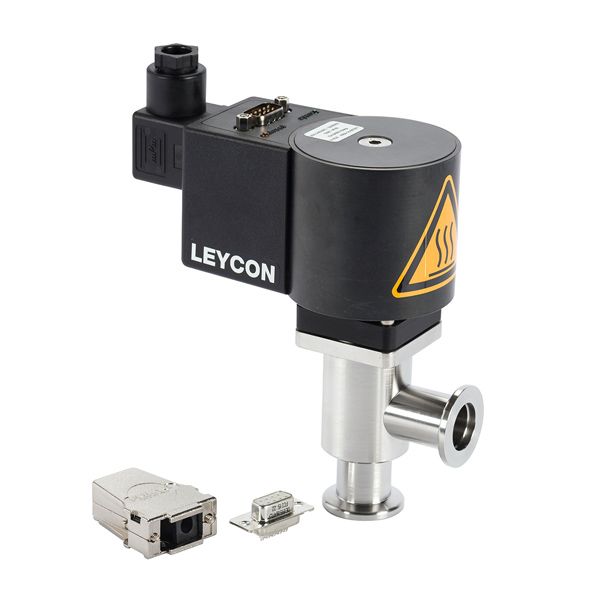 A black and silver industrial component branded "Leybold North America" with a warning sign indicating heat. Adjacent to it are two small metal connectors, suggesting that the ISO-KF Right Angle Valve, which is electromagnetically operated, is part of a larger mechanical or electronic system.