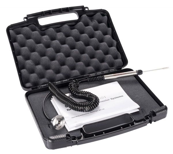 Open black carrying case with egg crate foam interior, containing a coiled cable device, a metal rod, and several instruction manuals. The setup appears to be for an SL301 - Sniffer Line for PHOENIX detection tool system by Leybold North America.