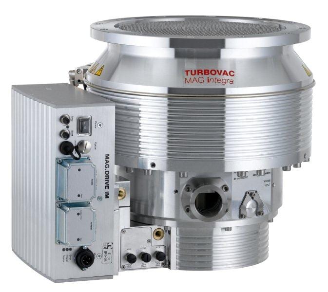 A high-vacuum turbomolecular pump with a shiny, metallic finish and cylindrical design. The device features various ports, connectors, and control panels, labeled "Leybold North America Shop MAG W 2200 iP, 24 V SPS interface" on the top cylindrical section. It is used in scientific and industrial applications.