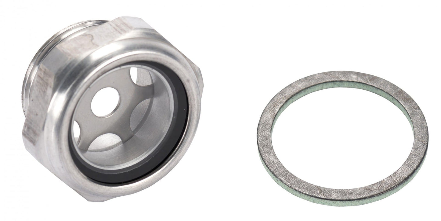 To the left is the Oil Level Glass suitable for SOGEVAC models SV 40/65/100/300 BR2 and SV 25/40/65/100 B by Leybold, featuring a metal body with a central hole and rubber lining often utilized in vacuum pump systems. On the right is a flat metal washer. Both items are displayed against a plain white background.