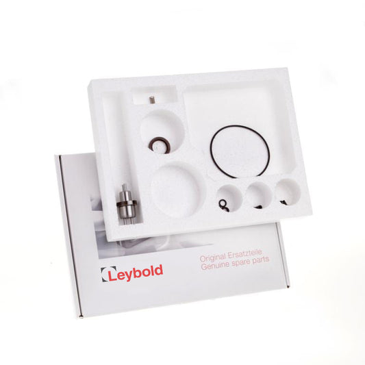 A Leybold North America Shop box contains a Repair Kit 1 TRIVAC D 2,5 E with genuine spare parts organized in a white foam tray. Rings, small metal components, and other items are neatly arranged in circular compartments.