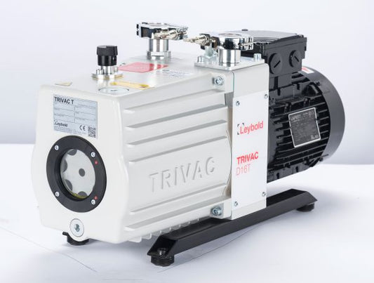 A Leybold TRIVAC D 16 T vacuum pump with a white and black casing, featuring multiple valves and gauges on top. The pump is positioned on a flat surface with "TRIVAC" and "Leybold" labels visible on its casing.