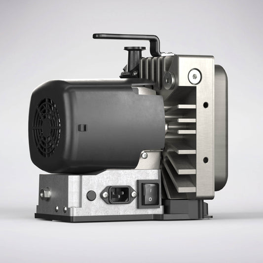 The image shows the Leybold SCROLLVAC 3 Plus, a compact and modern air compressor featuring a black motor housing, metallic components, and cooling fins. It is equipped with an electrical input socket, an on/off switch, and a handle on top. The overall design appears sturdy and industrial, making it suitable for various applications.