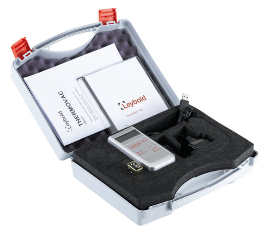 An Accessories Set TM101 / PV101 by Leybold North America, likely a measurement tool or analyser, is displayed in a hard plastic carrying case with custom foam insert. The case includes manuals, cables, and a USB drive. The name "Leybold North America" is visible on the device and printed materials.