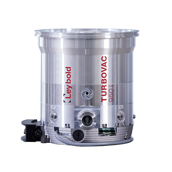 A metallic cylindrical device labeled "Leybold North America Shop TURBOVAC 950iX" with various connectors and components attached, resting on a flat surface. The device appears to be a vacuum pump or a related piece of engineering equipment.