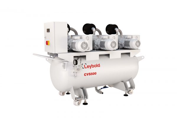 A Leybold North America CVS500 2XSV300B Basic vacuum pump system is shown. It features a cylindrical tank with the brand name and model number in red on the side. The top has three motorized pumps and a control panel. The unit is supported by a sturdy frame with wheels for mobility.
