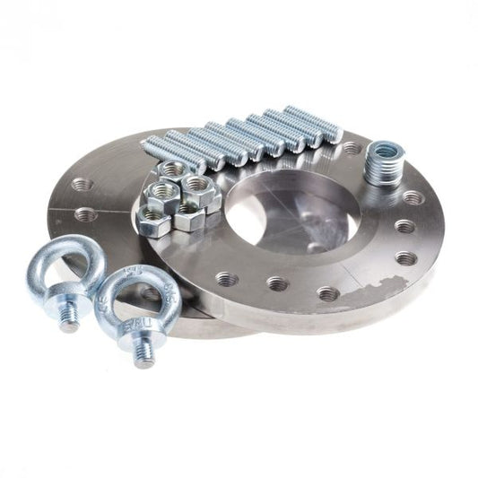 Two metal wheel spacers, an ASME-Adapter Flange 4" RUVAC WA/WAU/WS/WSU 1001 by Leybold North America, bolts, nuts, and two eye bolts are arranged on a white background—ideal for use with RUVAC vacuum pumps.