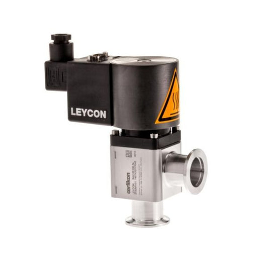 A Leybold North America-branded ISO-KF right angle valve, electromagnetically operated, with a black and silver body featuring a yellow heat warning symbol. The valve includes multiple fittings and connectors, as well as a cylindrical metal extension at its base.