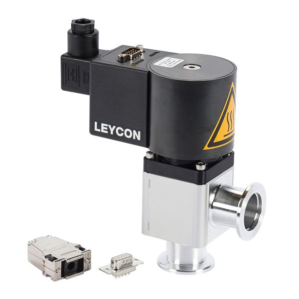 Image of a Leybold North America branded ISO-KF right angle valve, electromagnetically operated, featuring a black cylindrical part marked with a warning label, atop a metallic base with a connecting flange. Nearby are two smaller electronic connectors.