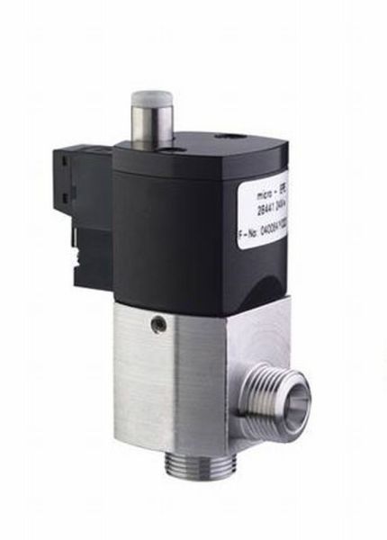A close-up of the Leybold North America Micro Right Angle Valve, an electromagnetically operated 24 V DC solenoid with a black top, metallic body, and threaded pipe connections, set against a plain white background.