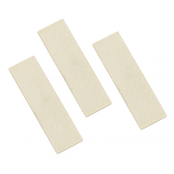 Three rectangular, white gum pieces are arranged diagonally in parallel to each other on a plain white background. Each gum piece has a waffle-like texture. This arrangement represents the Vanes SOGEVAC SV 10 B / SV 16 B - 3 Pcs. from Leybold North America.