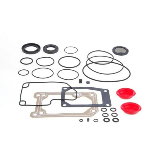 A collection of various rubber and silicone seals and gaskets of different sizes is laid out. The Seal Kit SOGEVAC SV 65 B - FPM by Leybold North America includes O-rings, flat gaskets, and red dome-shaped seals, possibly for automotive or mechanical use. The components are arranged neatly on a white background.