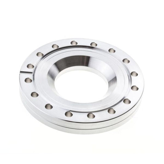 A Leybold North America Reducing Flanges DN 100/63 CF, featuring a metallic circular design with a central hole and evenly spaced outer holes, is commonly used in pipe systems. Shown on a white background.