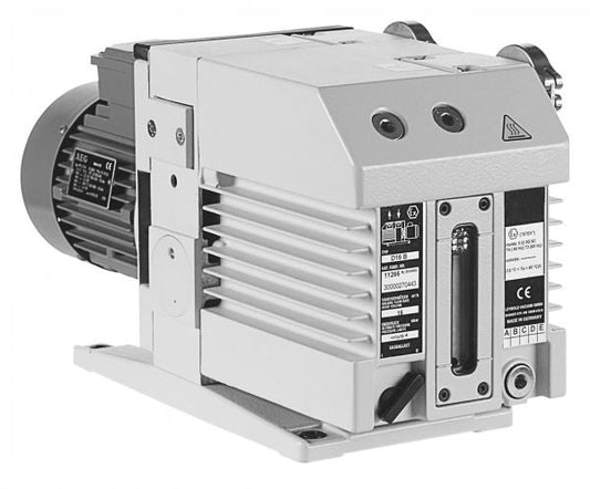 A black and white image of an industrial pump machine with various labels and specifications visible on its surface. The TRIVAC D 16 B by Leybold has vents and grates on its body and appears to be a technical device used in mechanical applications.