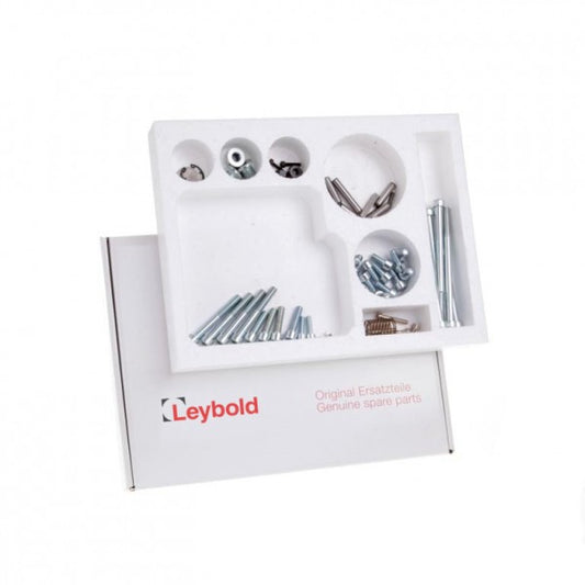 A white box labeled "Leybold North America" contains a Kit of Spare Parts TRIVAC S/D 40/65 B organized in a white foam insert. The box includes different types of screws, bolts, and small components neatly arranged in separate compartments.