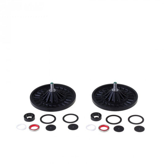 The image shows two black plastic wheels with gray metallic centers, arranged horizontally. Below the wheels are various circular components, including O-rings and washers in black, white, and red, laid out in two identical sets. The product shown is the Maintenance Kit DIVAC 0,8T by Leybold North America.