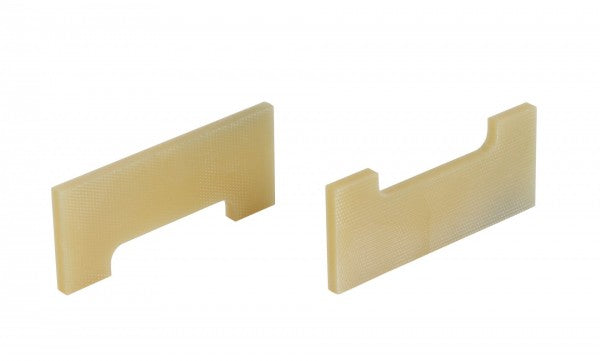 Two identical beige plastic components with rectangular shapes and a notch on one side are shown against a white background. They appear to be HV-Vane TRIVAC S/D25B  (2 pcs) replacement parts by Leybold North America, possibly for mechanical or industrial use.