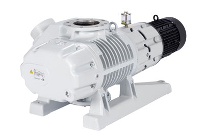 A robust, industrial-grade vacuum pump with a white finish. It has a cylindrical main body with ribbed detailing and multiple bolt attachments. The pump is mounted on a sturdy base and features a motorized unit at the rear. This is the Leybold RUVAC WAU 2001.