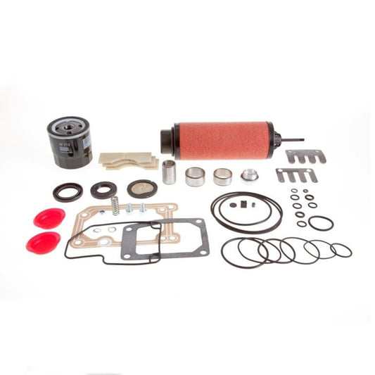 An assortment of car parts and accessories, including filters, gaskets, O-rings, seals, metal springs, screws, two red plastic caps, and various metal and rubber components from the Repair Kit SV 40 B by Leybold arranged on a white background.